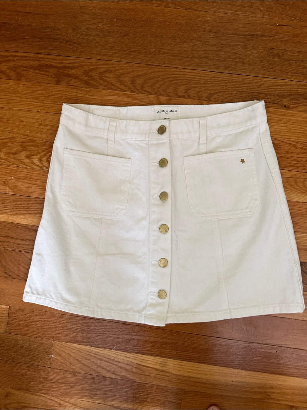 La Petite Etoile Paris White denim mini with gold buttons